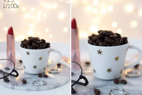 Filiżanka kawy, szminka i pierścionki na tle światełek. Efekt bokeh co to? To rozmyte kółka światła.