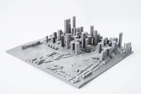 Model miasta z wieżowcami i niską zabudową, stworzony przez mapping 3d.