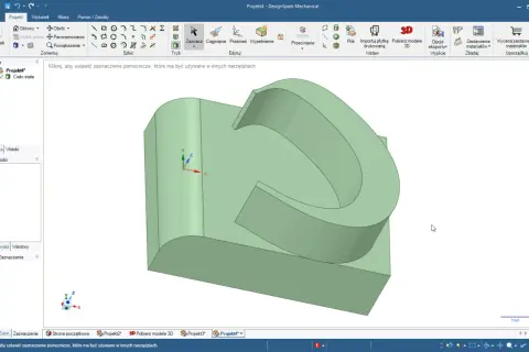 Projekt 3D w programie darmowy CAD. Widoczny zielony model bryły z zaznaczonymi osiami współrzędnych.