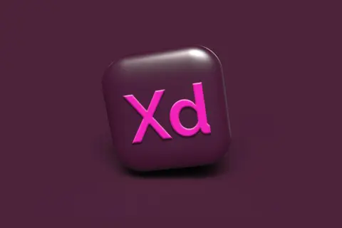 Ikona Adobe XD w kolorze fuksji na ciemnofioletowym tle. Narzędzie do projektowania interfejsów.