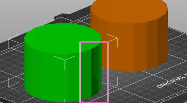 Zielony i pomarańczowy walec na siatce, element procesu projektowania 3D.