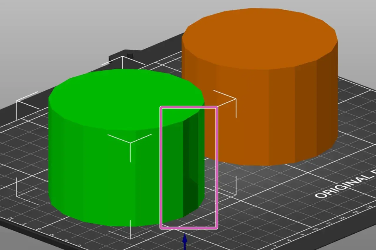 Zielony i pomarańczowy walec na siatce, element procesu projektowania 3D.