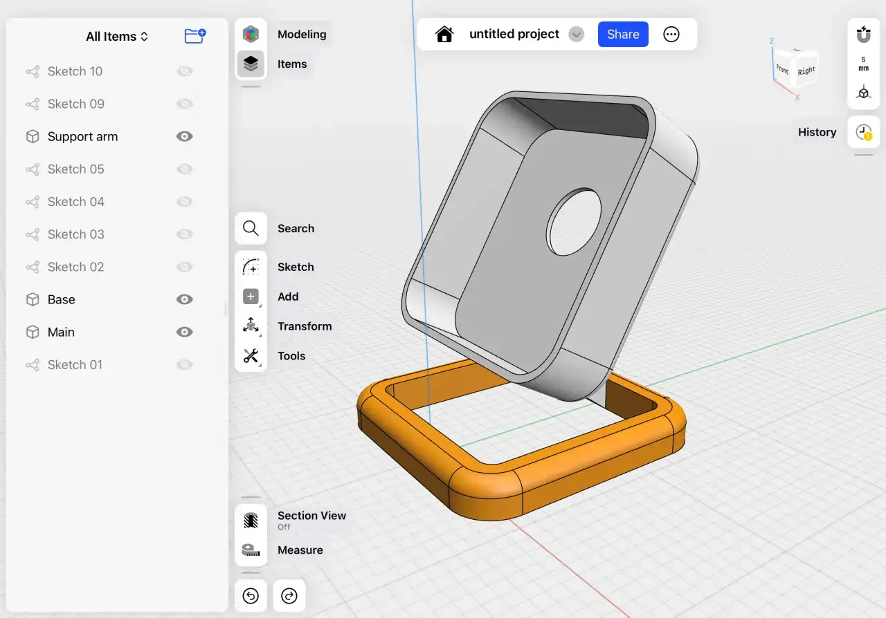Model 3D z pomarańczową podstawą i szarym elementem, przypominającym kształt z gry maya.