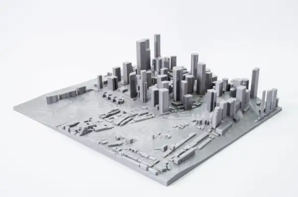 Model miasta z wieżowcami i niską zabudową, stworzony przez mapping 3d.
